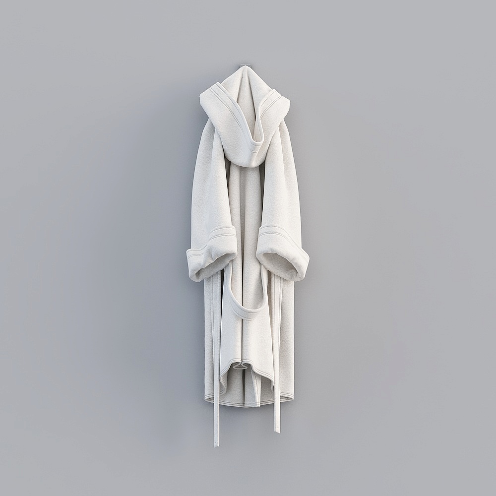 White cotton hooded bathrobe with long tie belt hanging on grey background