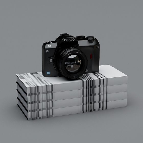 Black camera with large lens on white box with black stripes on grey background
