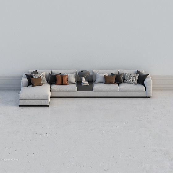 Modern light grey sectional sofa with brown pillows and side table on white background
