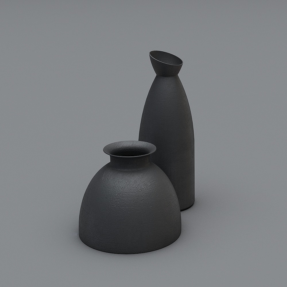 Two modern black ceramic vases with textured surface and simple shapes on grey background