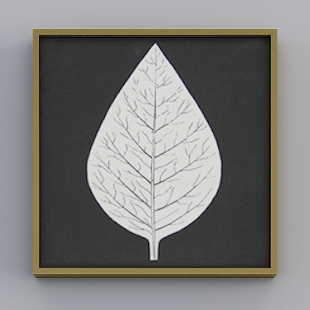 Square framed wall art with white leaf on black background inside gold frame on grey background