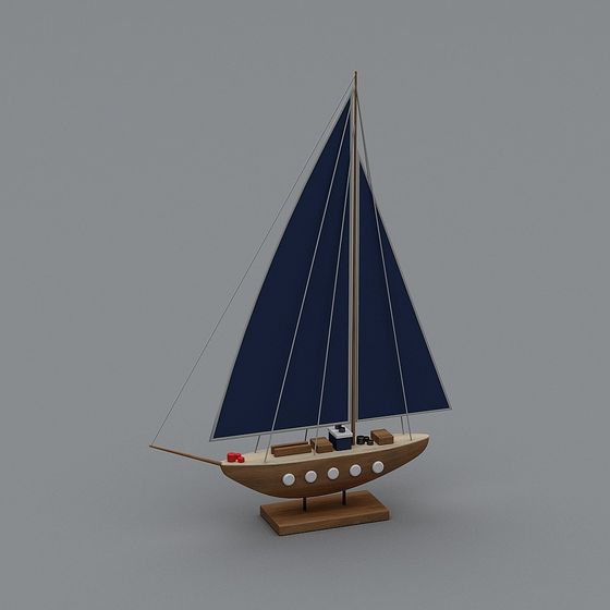 Wooden sailboat model with blue sails and white details on grey background