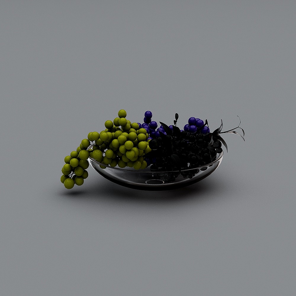 Clear glass bowl with green and purple grapes on grey background