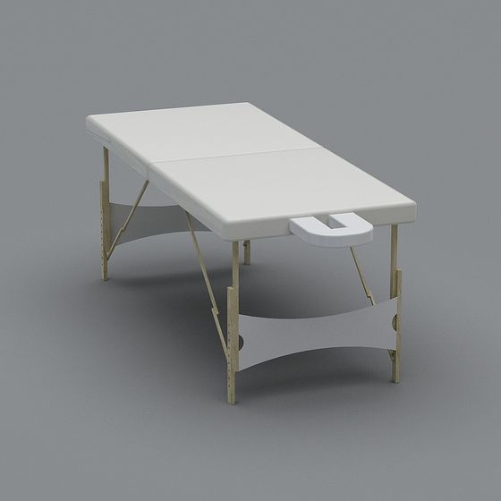 White padded massage table with wooden legs and face hole on grey background