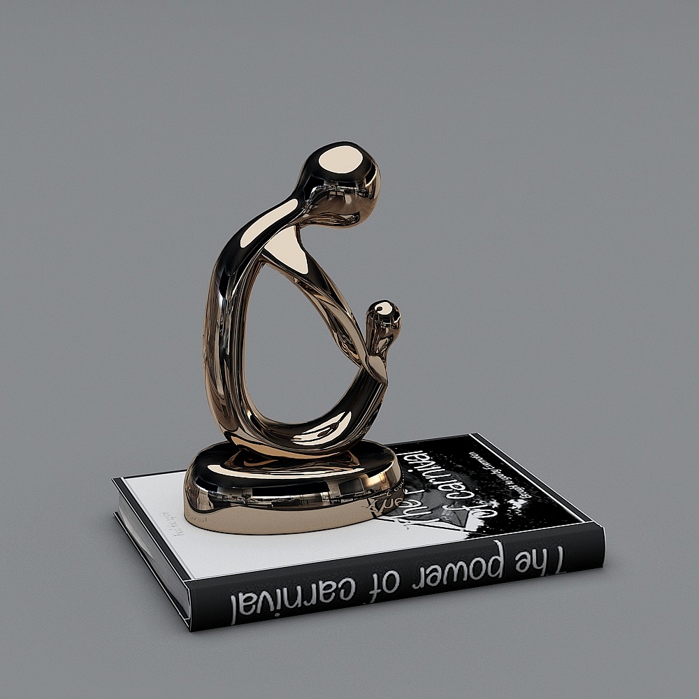 Modern abstract gold metal sculpture with curved shape on book on grey background